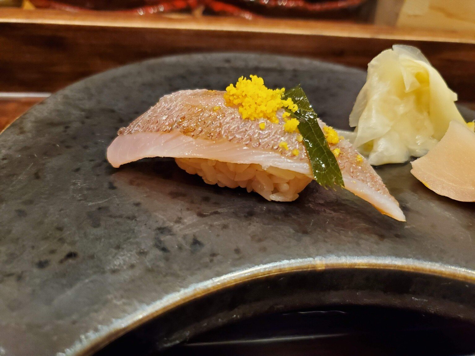 Silver-skinned nigiri with a delicate garnish